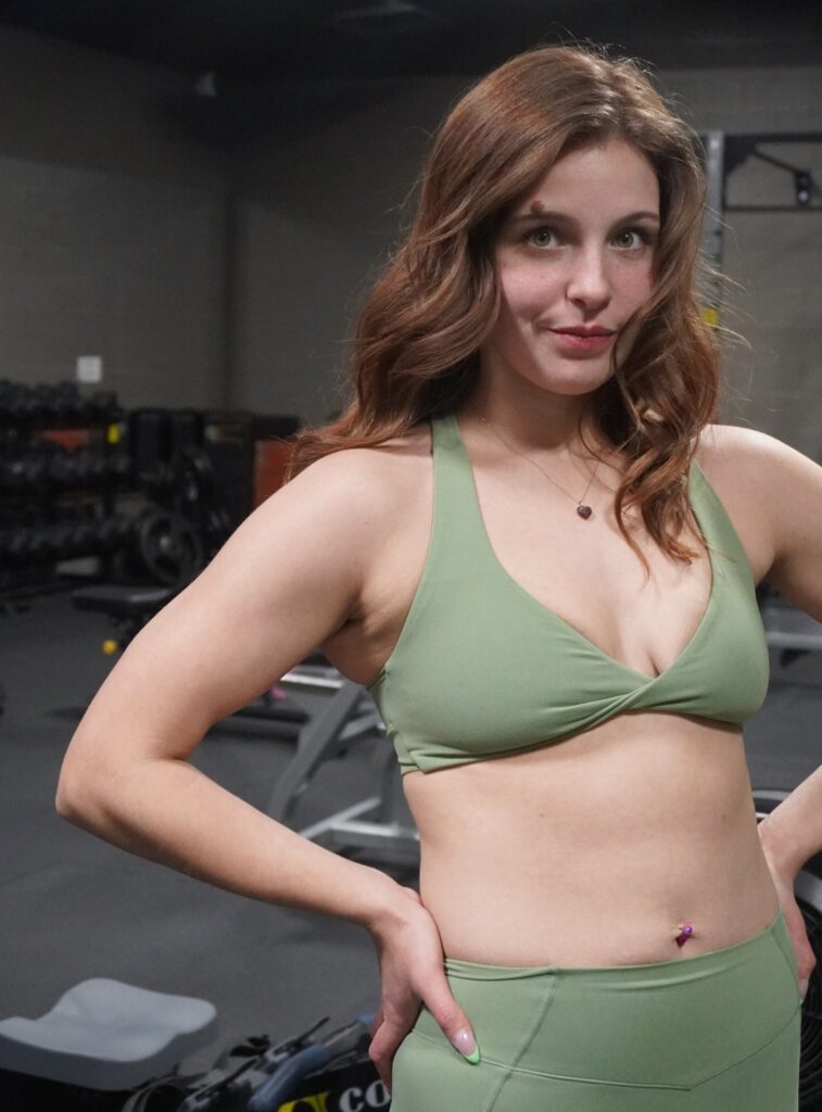An image of Christen Ross, Personal Trainer, standing in a fitness gym.